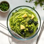 Noodle Salad with edamame, seaweed, and citrus–miso dressing in a glass bowl.